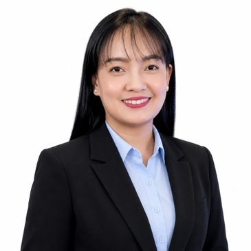 Professional woman in business attire smiling.