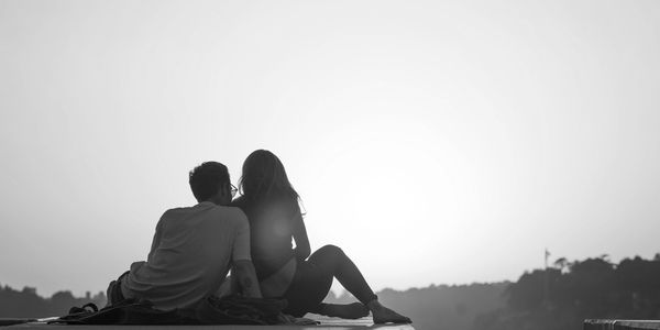 A couple watching the sun set