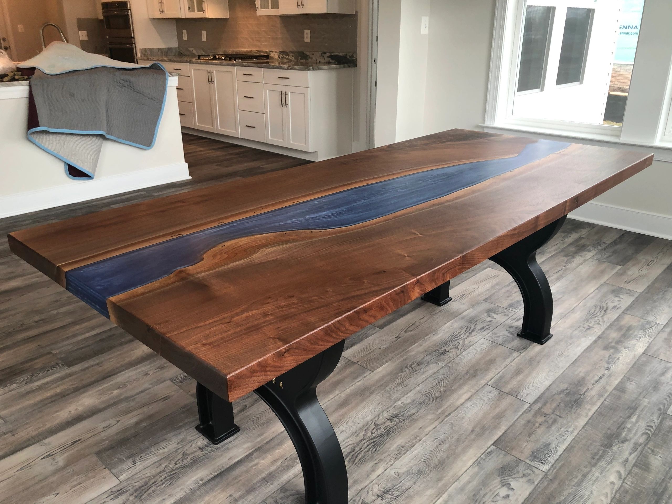 Walnut and epoxy river table with cast iron legs