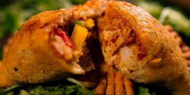Chicken Empanada - chicken, diced potatoes, onions, peppers, with blended herbs and spices.