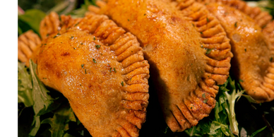 Pizza Empanada - pepperoni garlic, mozzarella, and Italian spices.