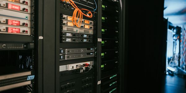 Close-up of server racks with network cables in a data center.