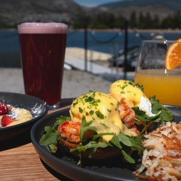 Chili lime and prawn eggs benedict on the patio, overlooking Skaha lake. Daily breakfast!