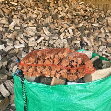 firewood logs being put into nets