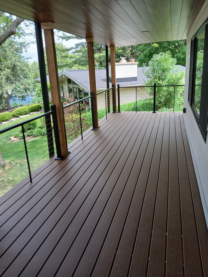 Trex Composite deck with black cable railing and cedar post