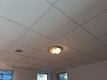 Remodeled basement with new drop tile ceiling