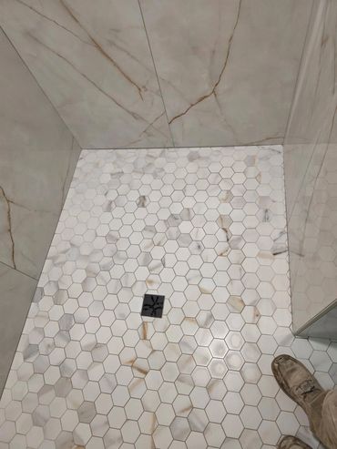 New tiled walk-in shower in remodeled bathroom.