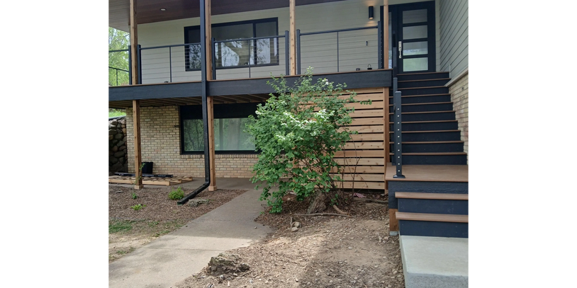 Composite deck with steel cable railing by Thomm & Murf Remodeling