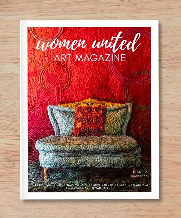 Cover of Women United Art Magazine featuring a textured blue sofa against a vibrant red textured wall.