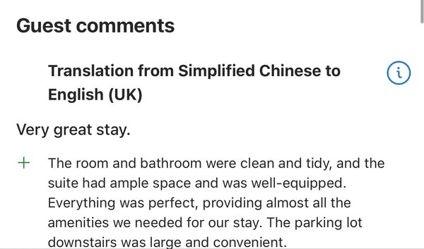 Guest review praising clean rooms, spacious suite, and convenient parking.