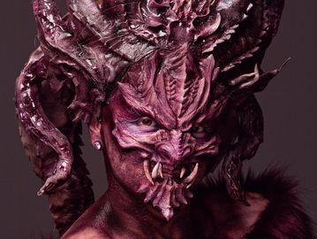 Makeup and creature design with applied prosthetic work on female model