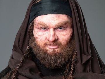 Prosthetic makeup application and hand laid hair to transform female model to the male character