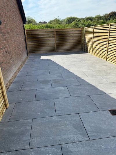 A porcelain patio and fence installation