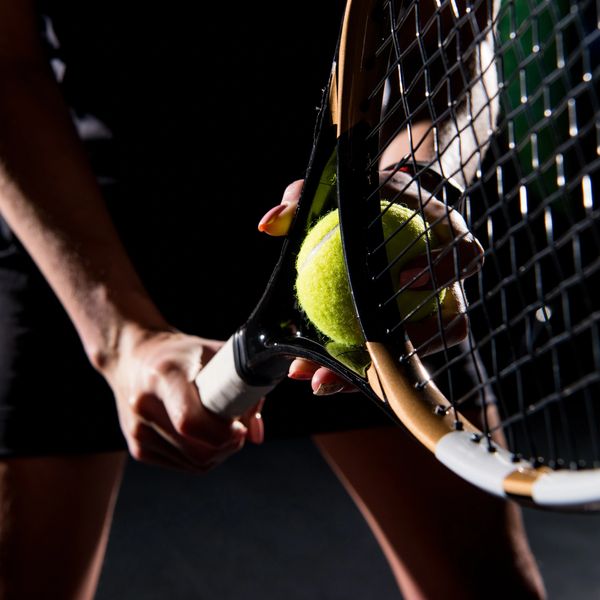 Photo of a tennis player setting up for a serve