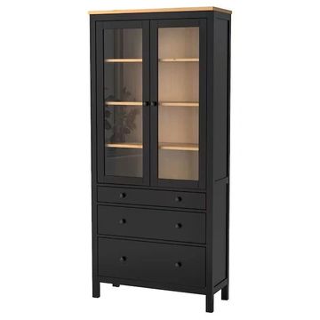 Tall black cabinet with glass doors and wooden top, featuring drawers below.