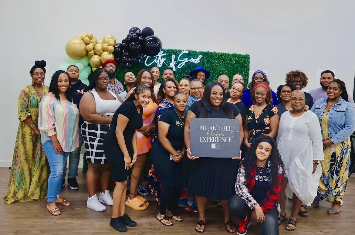 Group of people posing celebrating a healing experience event.