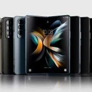 A lineup of modern foldable smartphones in various colors.