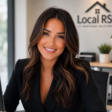 Smiling woman with long hair in an office setting.
