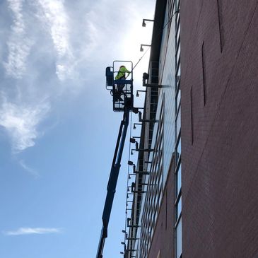 Commercial Window Cleaning. Using a boom lift and pure water fed pole on Chase Field.