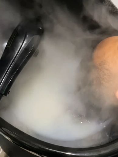 Steam rising from a pot or cooking vessel.