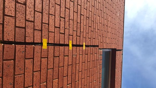 Apartment Block Cracked Wall Before