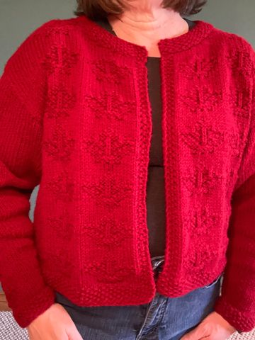 Knitted cardigan covered in maple leaves