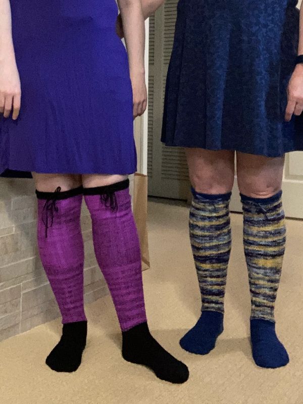 Two people wearing over the knee socks