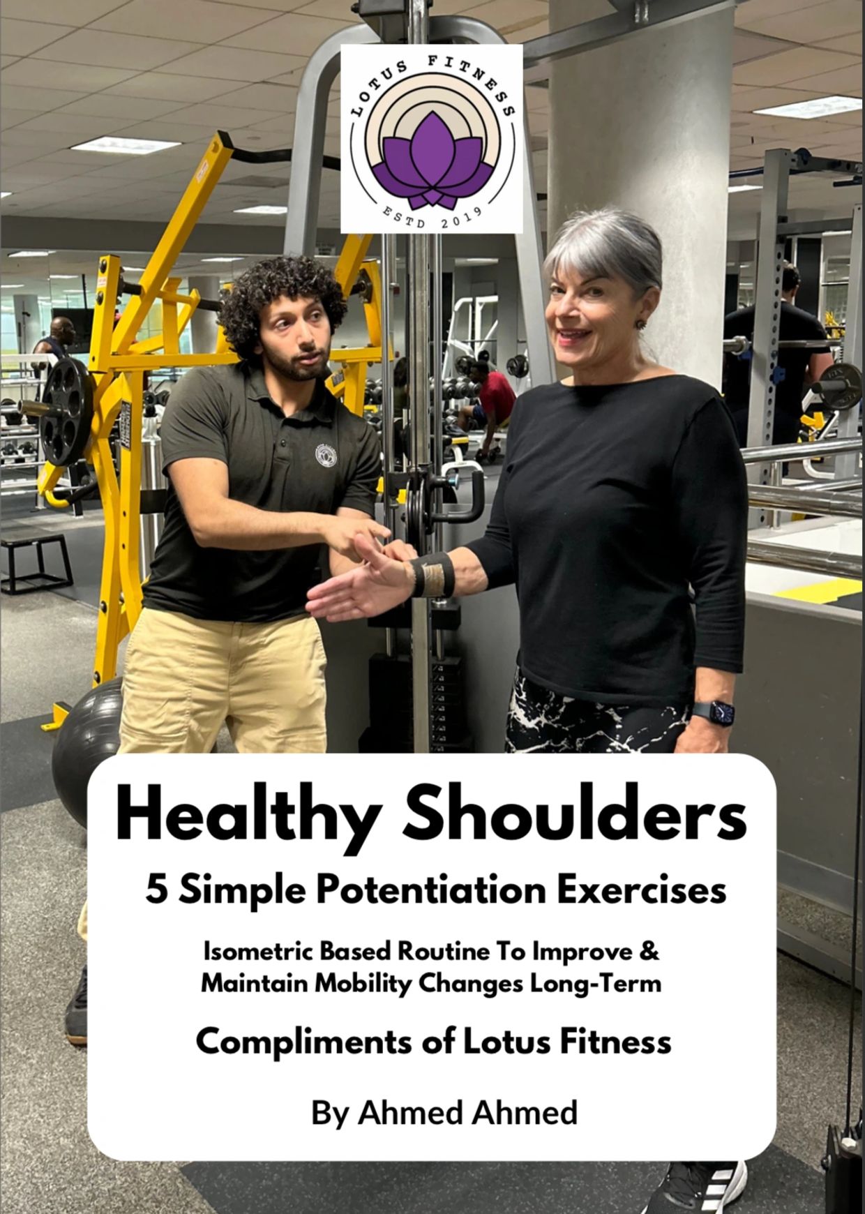 Trainer and client at Lotus Fitness promoting shoulder health exercises.