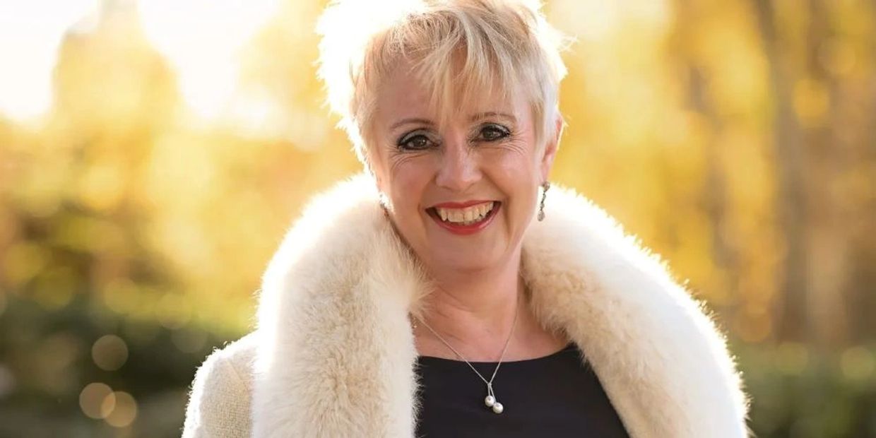 Smiling celebrant creating ceremonies to celebrate & remember