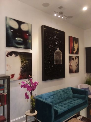 Oil paintings on canvas installed on white wall in living room