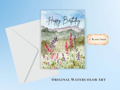 Wildflower meadow and mountains with Happy Birthday 