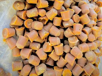 Sugarcane stalks and jaggery pieces placed together.