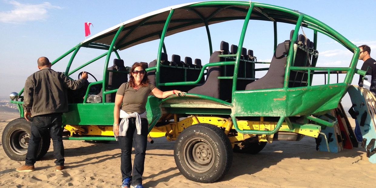 Stephanie riding a dune buggy in Huacachina, Peru