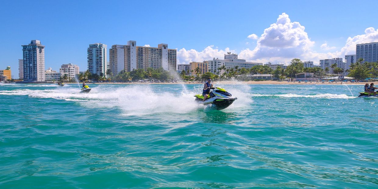man riding a jet ski from archie jet ski rentals in Puerto Rico