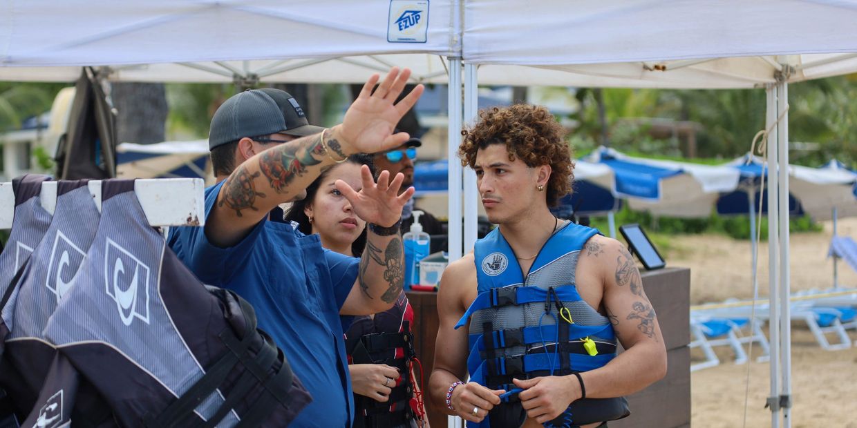 employee explaining how to ride a jet ski from archie jet ski rentals in Puerto Rico