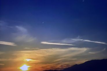 Scenic evening horizon with gentle clouds spread across the sky