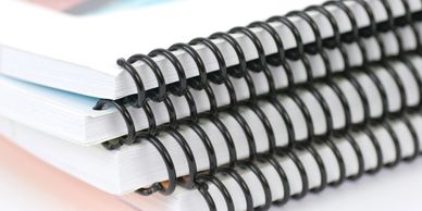 Printed training manuals, custom coil binding, presentation printing, bindery