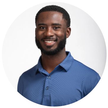 Smiling man in blue collared shirt.