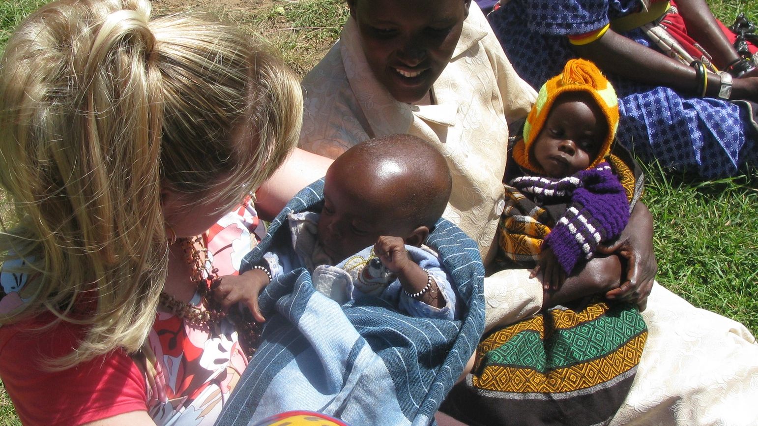 Deborah is Masai Mara clinic fascinated by new friends and a beautiful baby, part of Kensington Care