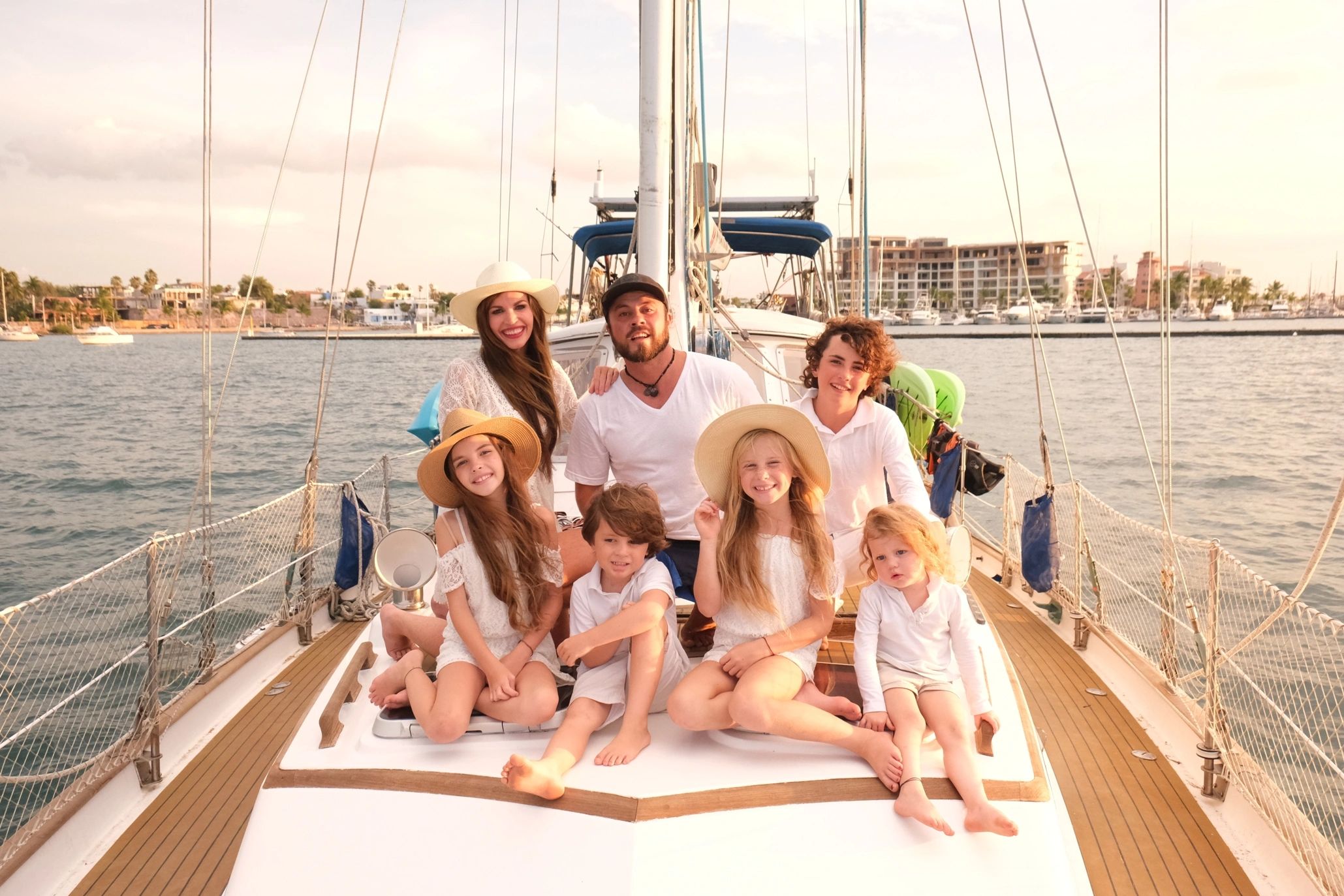 family sailing around world catamaran