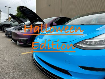Line of colorful cars with Halloween Edition text.