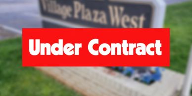 Sign showing 'Under Contract' in front of Village Plaza West.