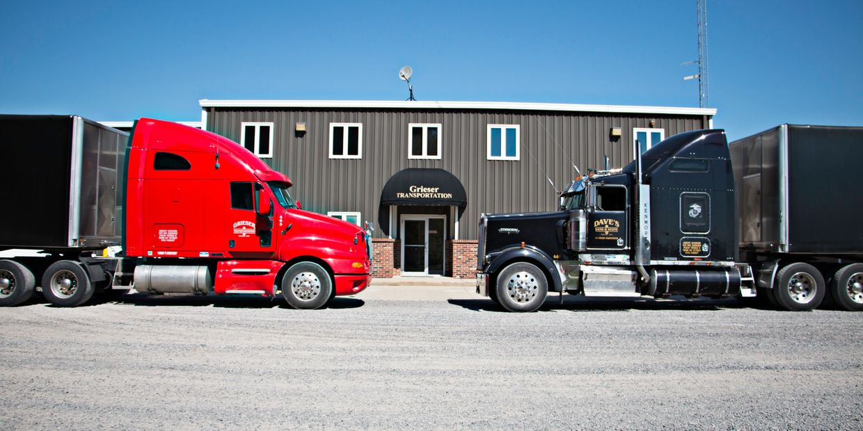 Two of our trucks in front of our shop and office facility.