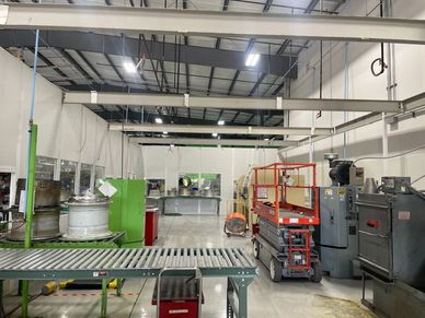 A white modular tall wall building enclosure for machinery, with beams across by SoFlo Installations