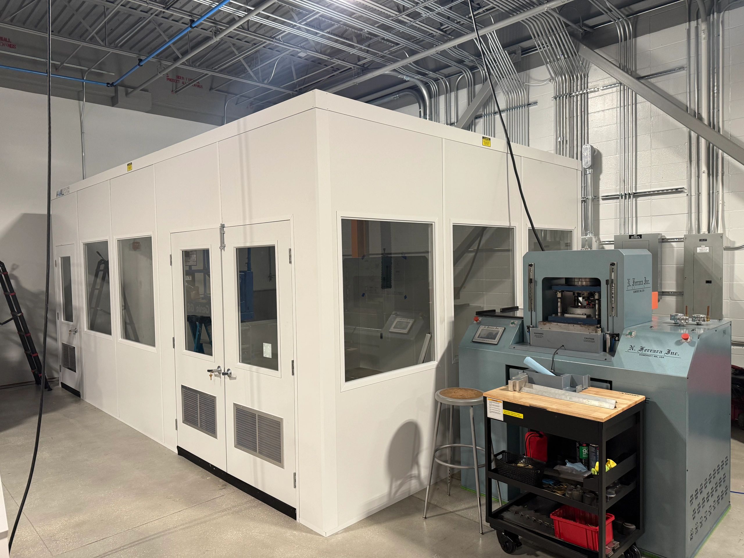 A newly constructed modular prefab building with several windows and double door, built by SoFlo.
