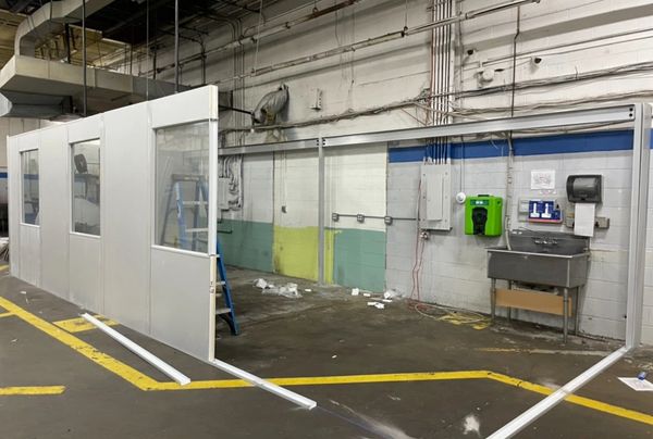 Three modular office installation coming off an existing wall with electrical pipes by SoFlo Install