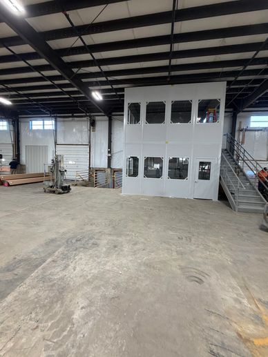 A two-story modular office installation with Windows, doors on both floors, by SoFlo installations
