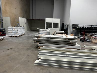 Inside a warehouse office space getting ready to build a new modular office building.