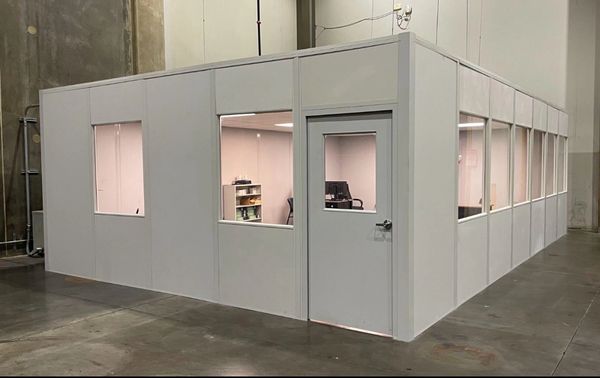 A white large modular office solutions installations with windows all around, door. By SoFlo install