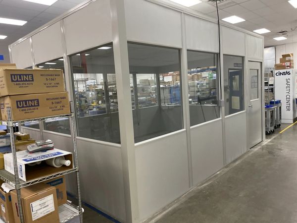 A modular installations designs with windows all around, inside an office workspace by SoFlo install